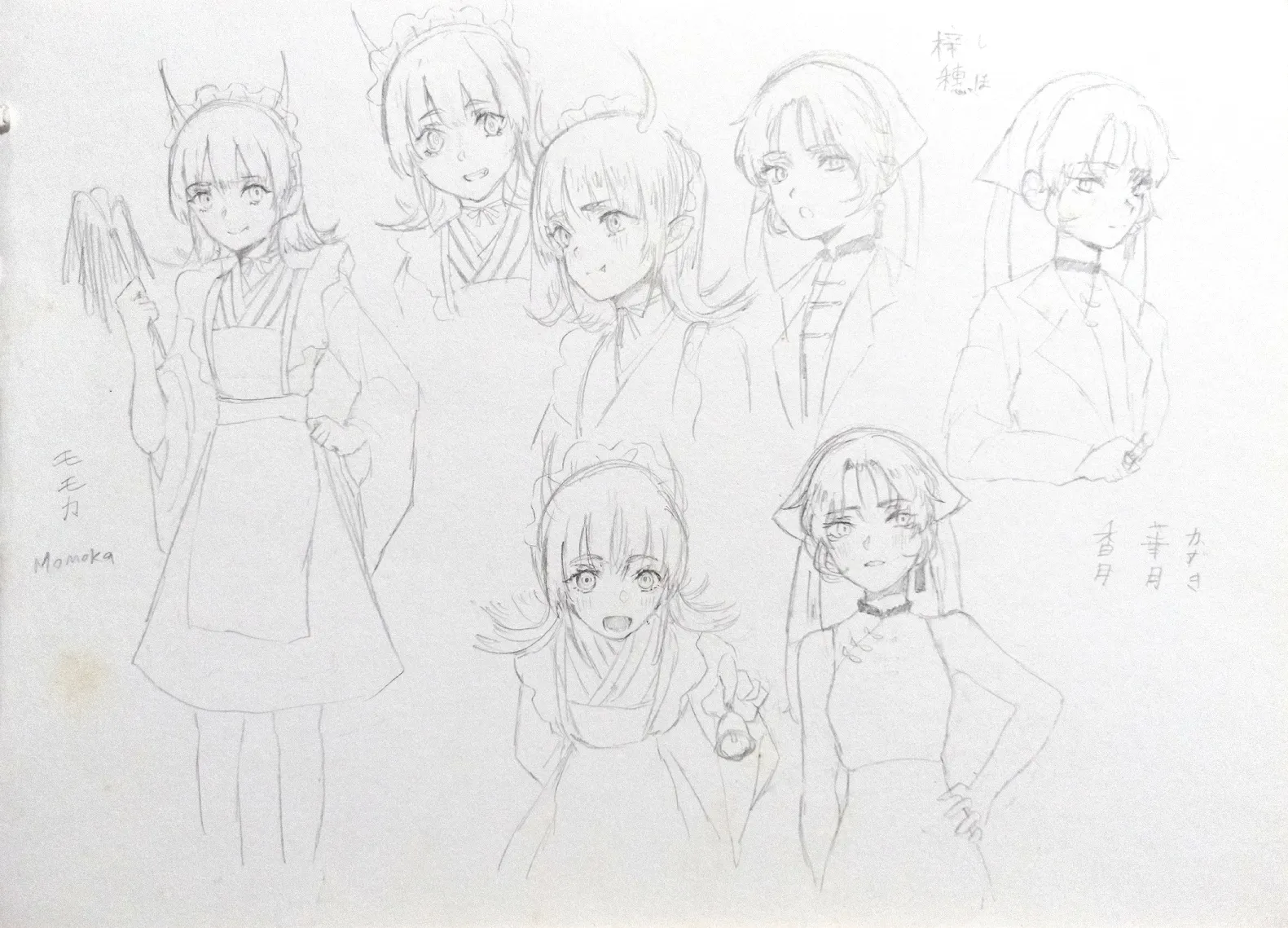 Sketches of Momoka and Shiho on a sketchbook.